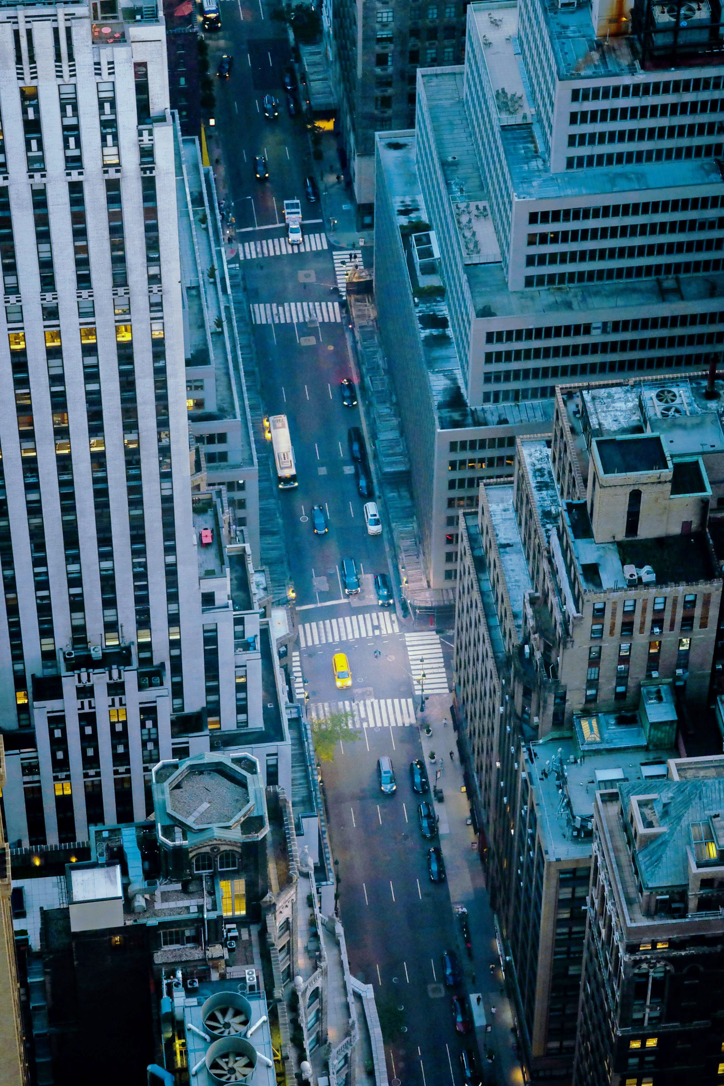 Aerial view of a city street with traffic at dusk